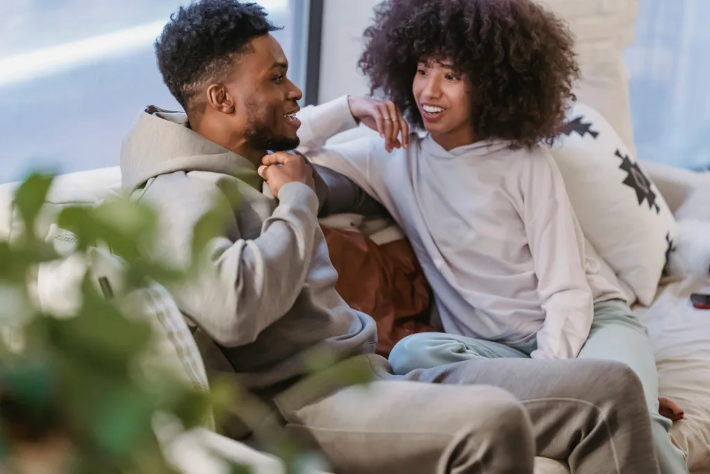 Relationship Questions How to Know if He's the One. Couple Having a Conversation on a couch