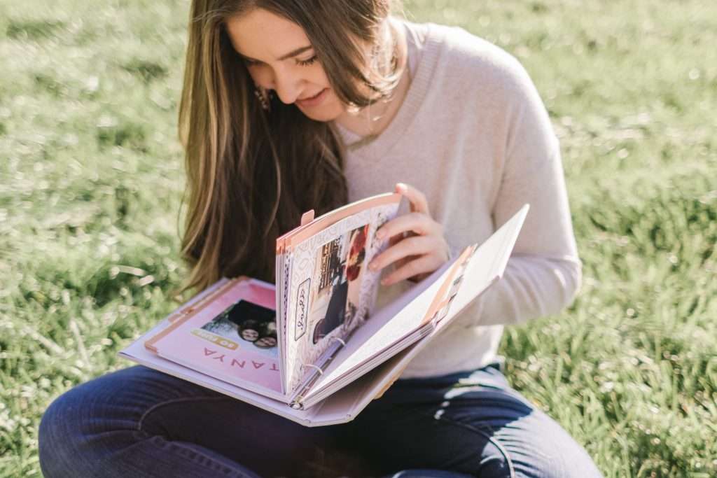 Woman flipping through her prayer journal