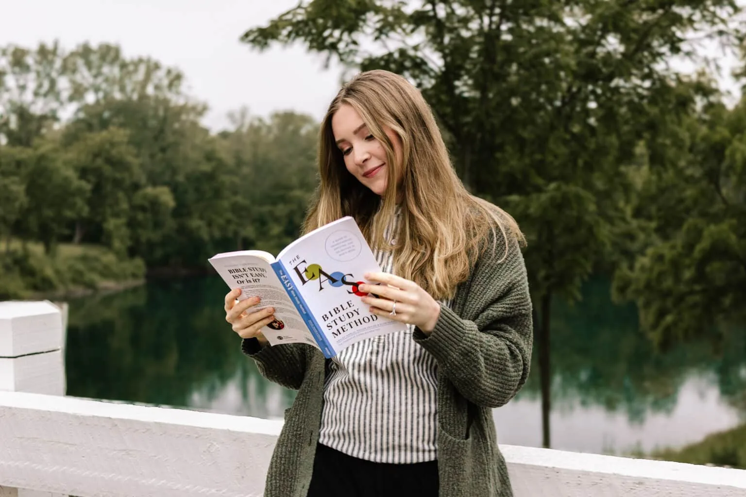 Taylor of Coffee and Bible Time reading the new easy way to study the Bible Book, "The EASY Bible Study Method".