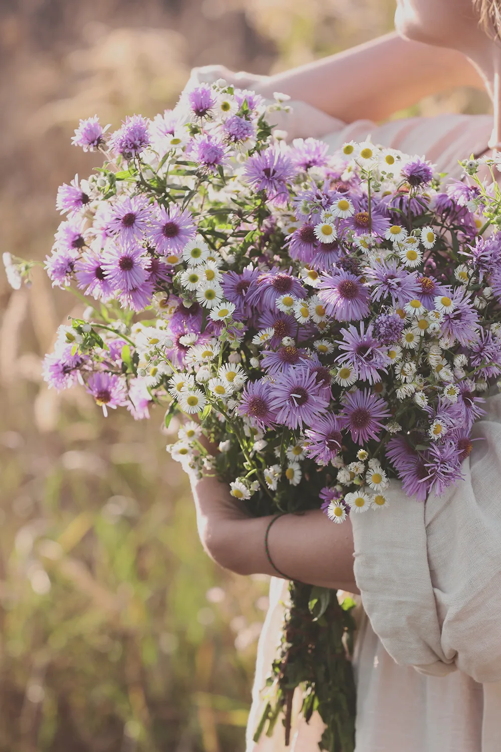 Woman holding bouquet of beautiful wild flowers outdoors, closeup Prayer Calendar for September Coffee and Bible Time