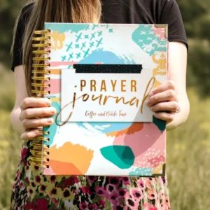 Prayer Journal for Women being held by a woman to show the cover