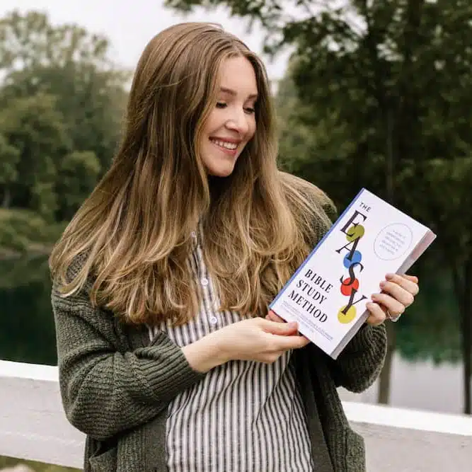 Woman showcasing The Easy Method for Studying the Bible in a natural setting.