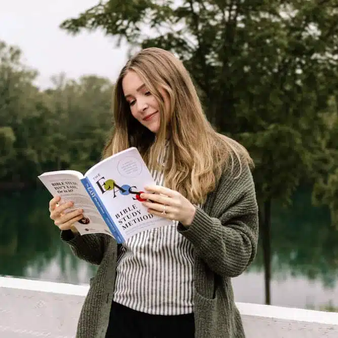 Woman peacefully reading The Easy Method for Studying the Bible book during quiet time.