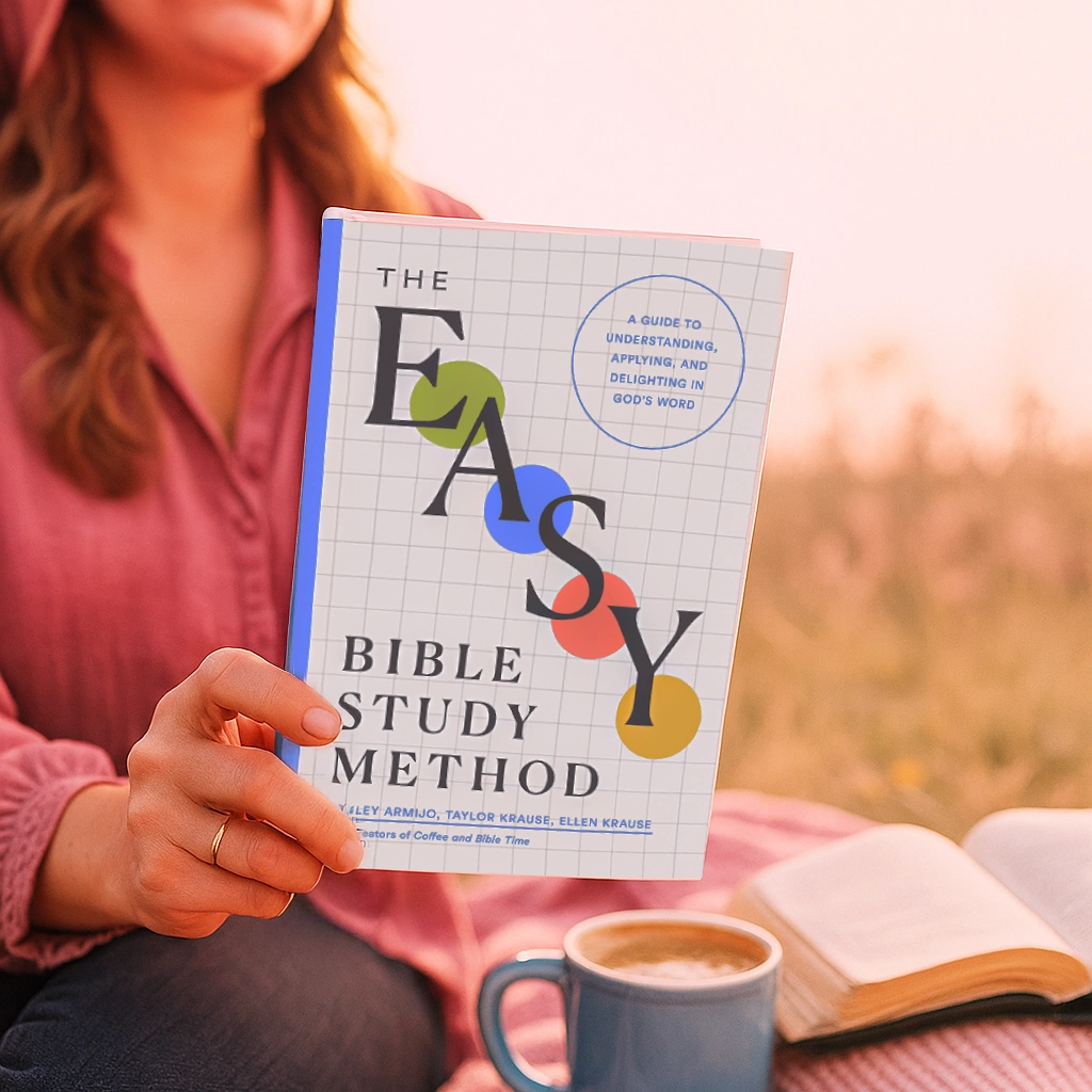The EASY Bible Study Method Book being held by a woman in a pink field