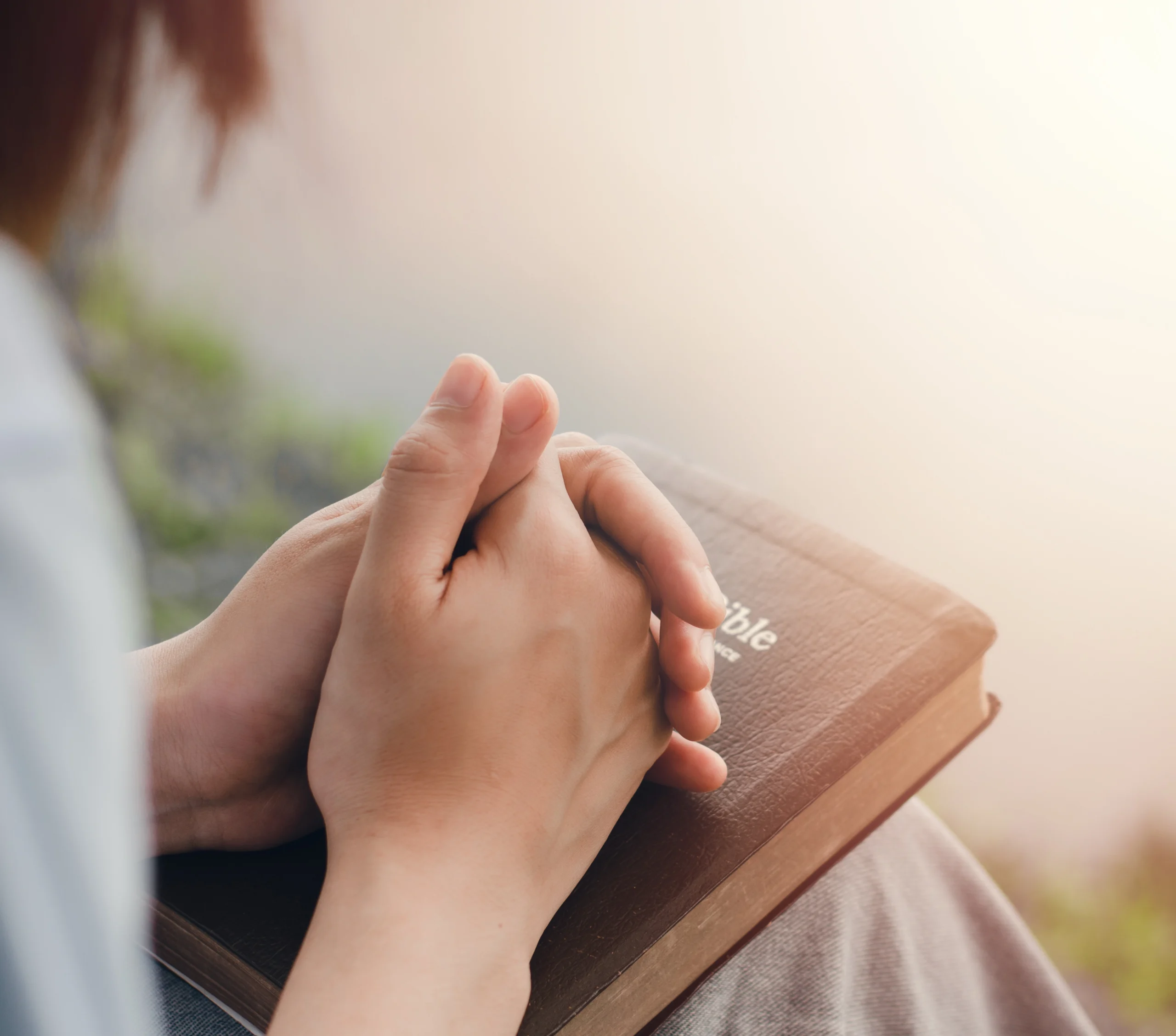 Free Printable Prayer Calendars 2 Woman praying with a Bible.