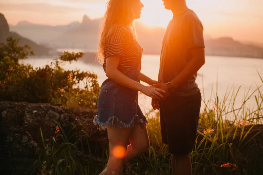 The Five Love Languages Explained with Dr. Gary Chapman and Ellen Krause Coffee and Bible Time Podcast. Picture of woman and man in a field holding hands romantically. 