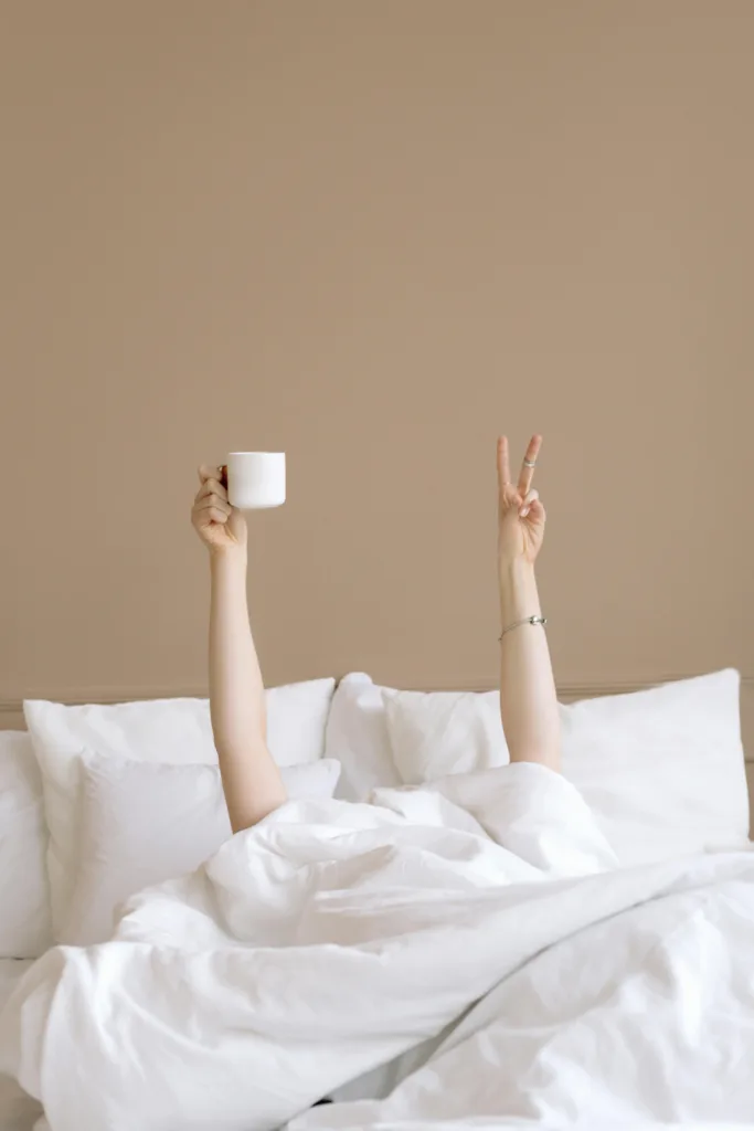 Girl in bed with coffee., waking up for mornings with God