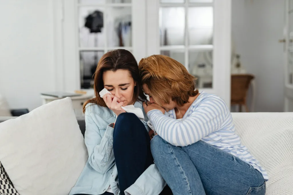 two women hugging, one is crying, showing how to practice trusting God in hard times
